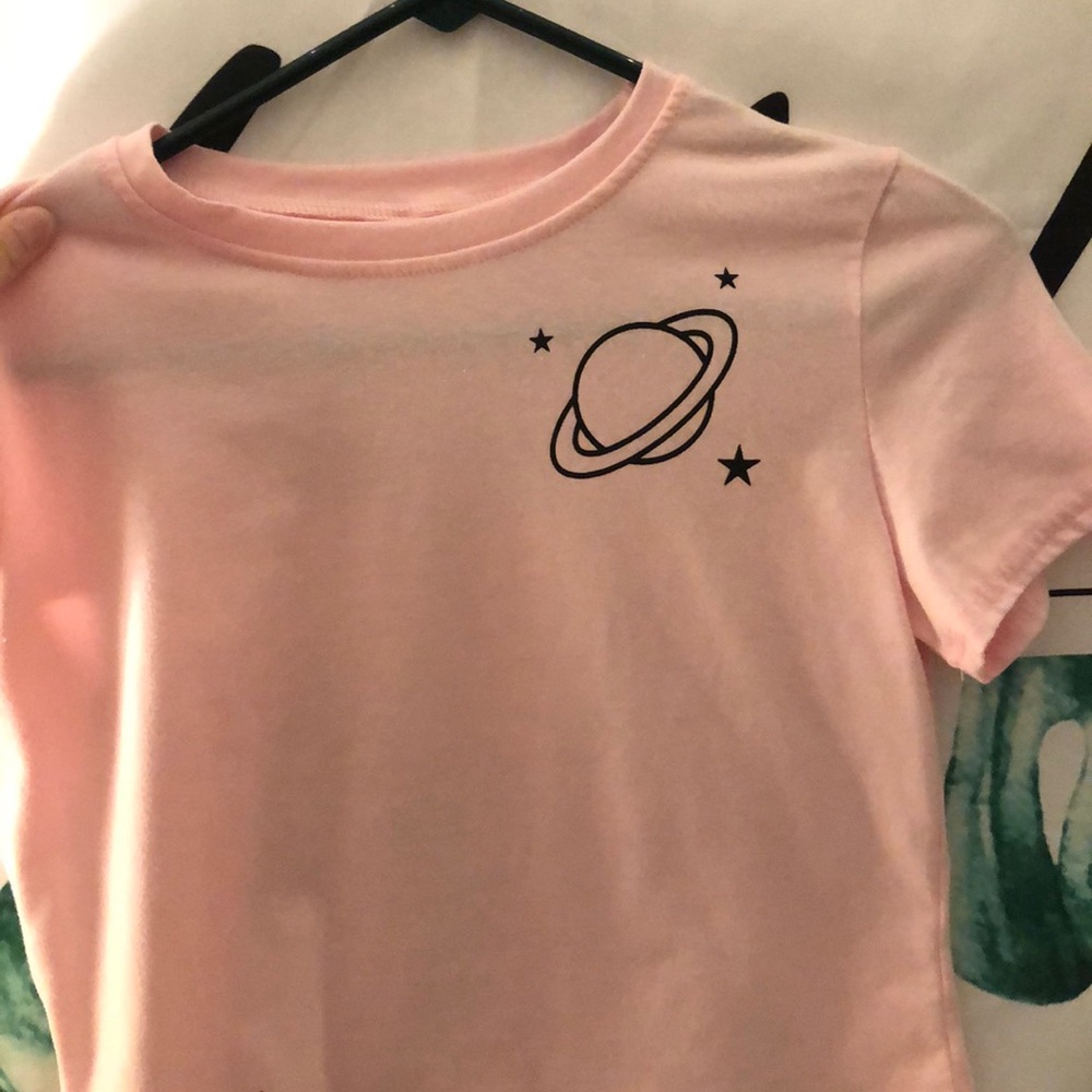 A pink cropped top